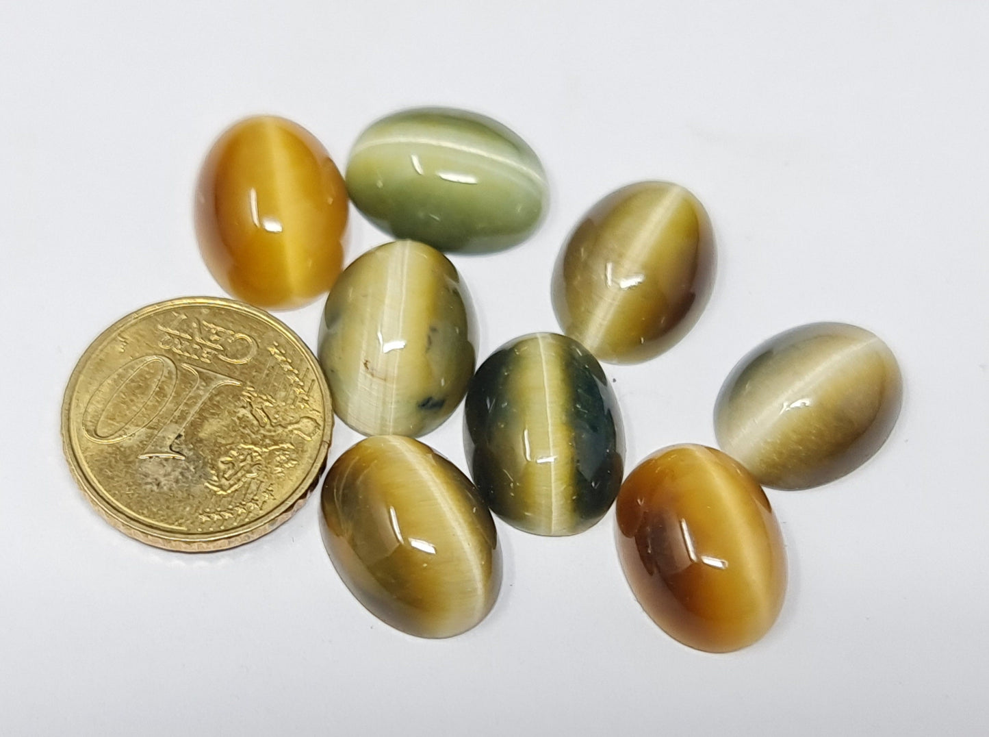 Nr.157 Chrysoberyll Katzenauge, verschiedene Varianten, oval, Tropfen, rund, beige, grün, gelb, rot