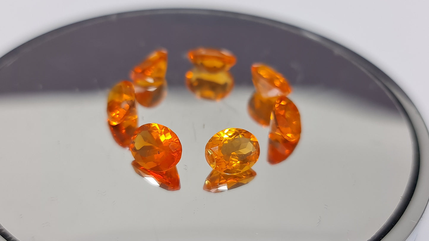 Nr.134 Set :7 Stück mexikanische Feueropale, orange bis rot, oval facettiert,9x7mm insg. 8,73ct