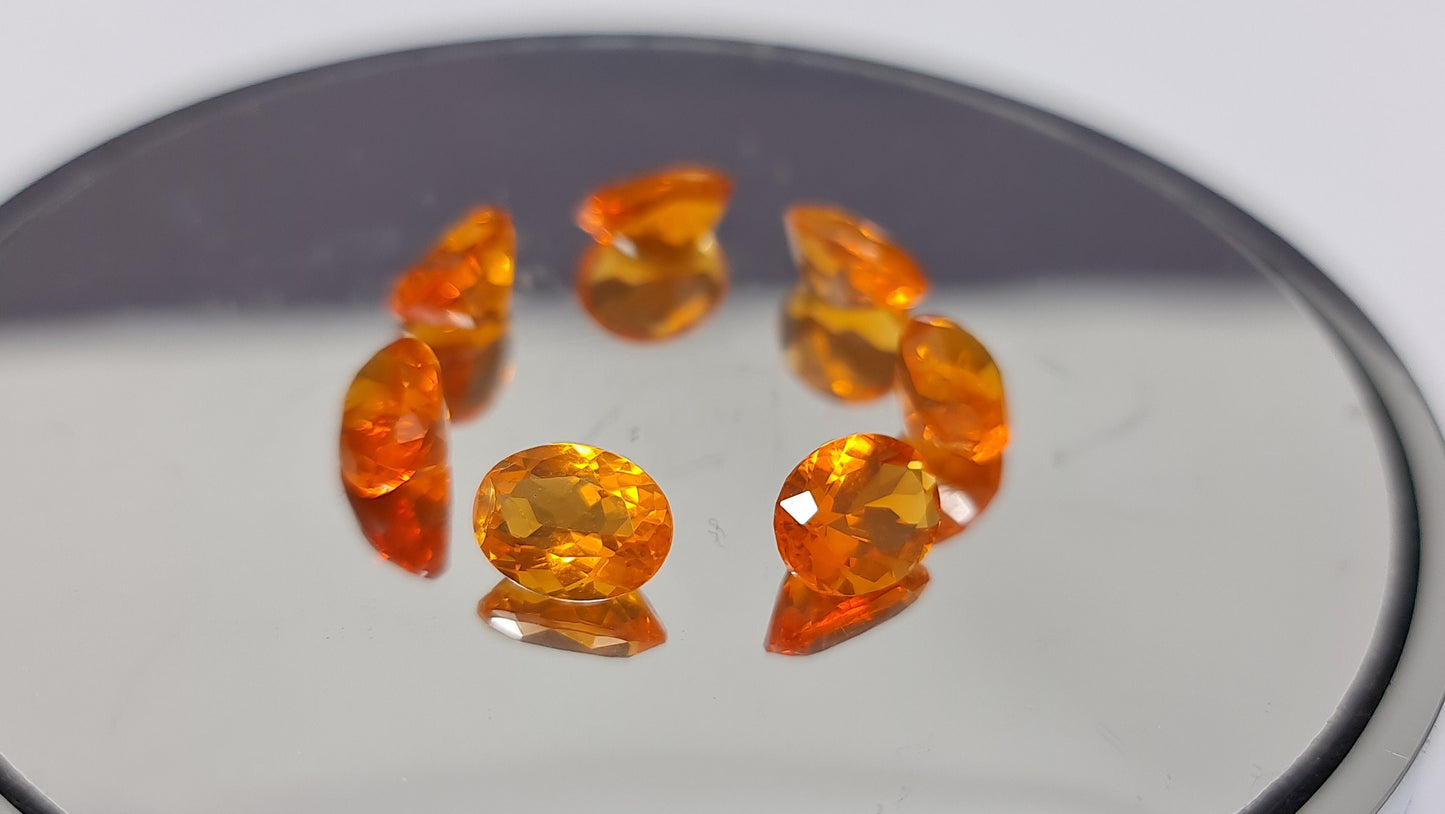 Nr.134   Set :7 Stück mexikanische Feueropale,  orange bis rot, oval facettiert,9x7mm insg. 8,73ct