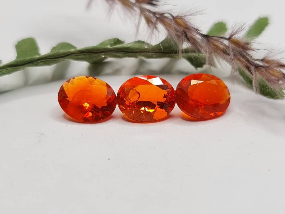 Nr.219 Feueropal aus Mexiko, oval, orange, facettiert 9,7mm ca 1,3ct *Preis gilt pro Stück*