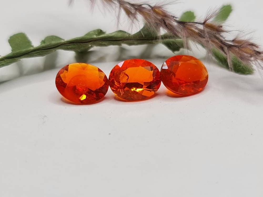 Nr.219 Feueropal aus Mexiko, oval, orange, facettiert 9,7mm ca 1,3ct *Preis gilt pro Stück*